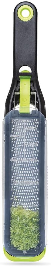 Dreamfarm Ozest Self-Cleaning Zester with Pop Button - 1mm Fine Zesting | Grates fine, citrus zest, parmesan, nutmeg and spices with concave, sharp stainless steel plane and non-slip silicone foot
