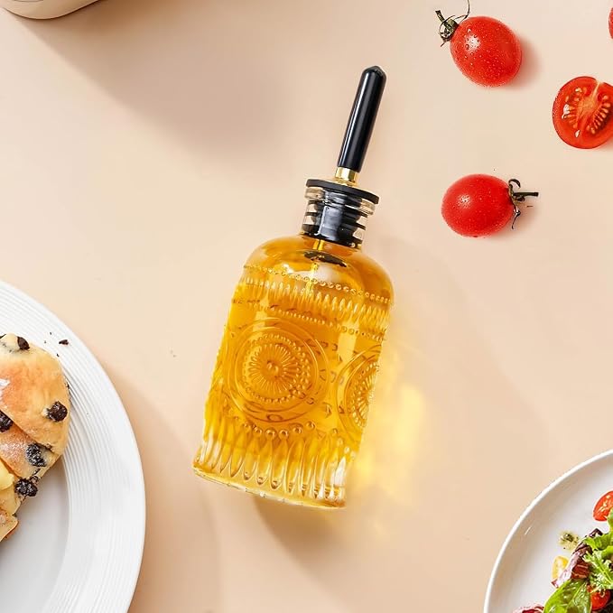 gegewawa Glass Olive Oil Dispenser Bottle, Small 7oz, Metal Spout, 1 Pack | This small olive oil dispenser has embossed glass for grip and vintage kitchen style; its clear body shows when to refill