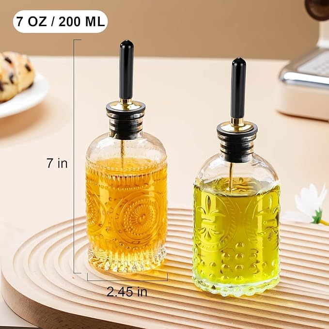 gegewawa Oil Bottle Set of 2, 7 oz Glass Dispensers with Metal Pourers | Embossed nonslip bottles include airtight stoppers, silicone caps and a funnel for pouring cooking oil, vinegar or syrup
