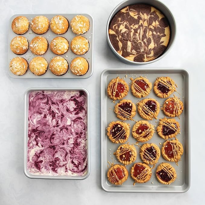 Nordic Ware Brilliant™ Colorful 4-Pc Baking Set, Nonstick made without PFAS or PTFE for safe cooking; Reinforced steel rim prevents warping; Half Sheet, 9x13 Inch Pan, 9-Inch Round Pan and Muffin Pan