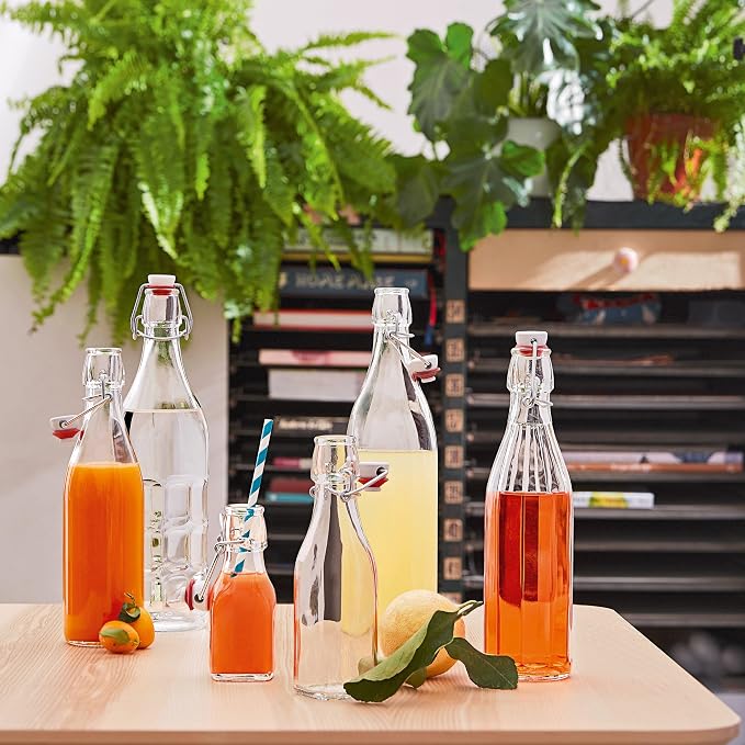 Bormioli Rocco Moresca Swing Top Bottles Set of 2-33.75 oz Airtight Glass Containers with Vintage Design for Oils, Vinegars, Liqueurs & Homemade Dressings - Reusable Italian Glass